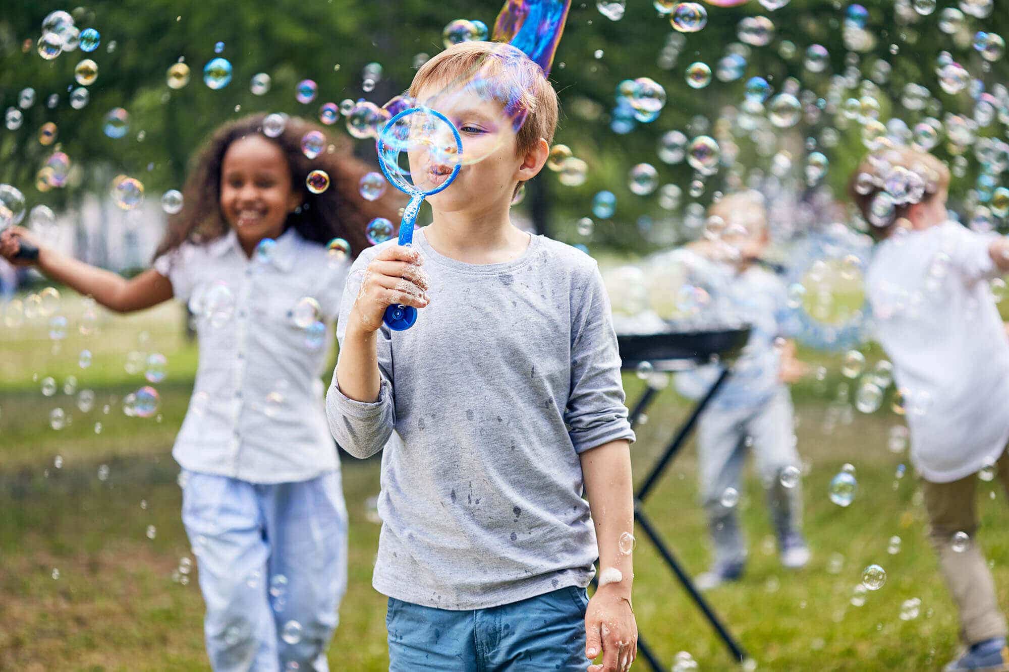 joyful-kids-making-soap-bubbles-2023-11-27-04-59-06-utc.jpg